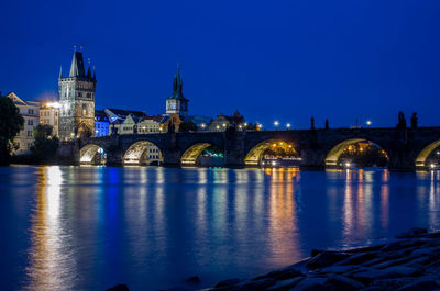 Illuminated city at waterfront