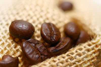 Close-up of roasted coffee beans on wicker