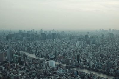 High angle view of buildings in city against sky