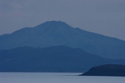 Scenic view of silhouette mountains against sky