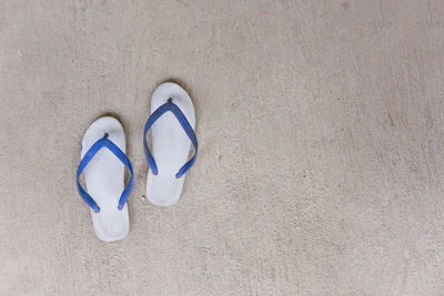 High angle view of shoes on sand