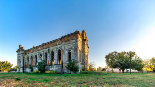 Old building against clear blue sky