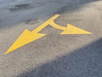 Arrow sign on road