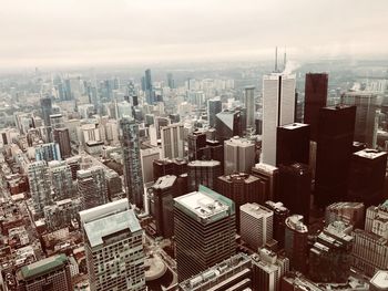 High angle view of modern buildings in city against sky