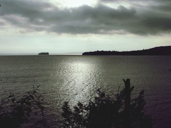 Scenic view of sea against cloudy sky