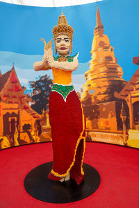 Close-up of statue against temple outside building