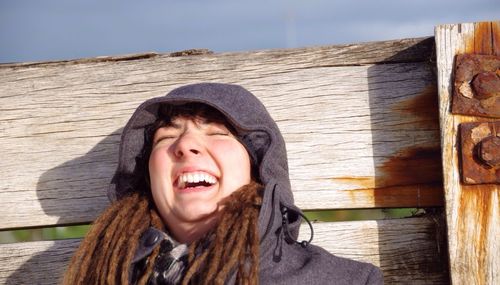 Woman in hood laughing