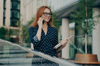Young woman using mobile phone