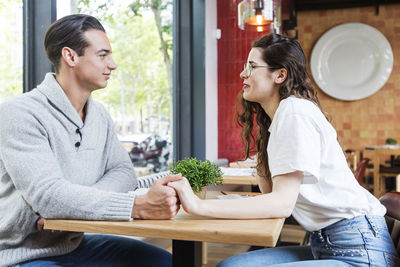 Business couple sitting at restaurant