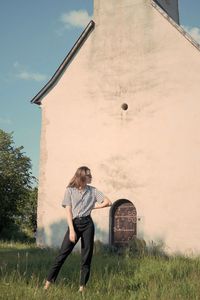 Full length of woman on field against sky