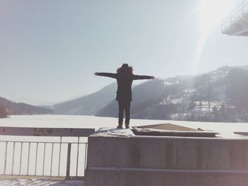 Man standing on mountain against clear sky