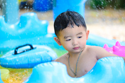 Portrait of boy swimming in pool
