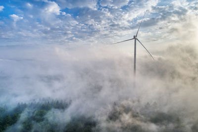Germany, baden-wuerttemberg, schurwald, aerial view of wind wheel and morning fog