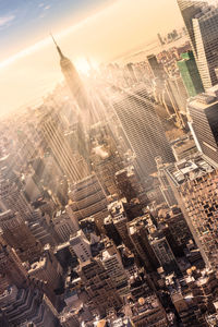 High angle view of modern buildings in city against sky