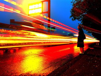 Blurred motion of people walking in city at night