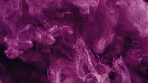 Close-up of purple ink in water