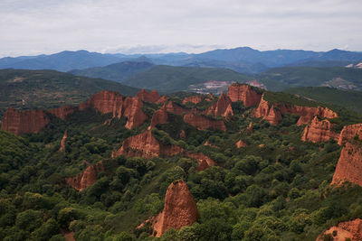 Aerial view of landscape with mountain range in background