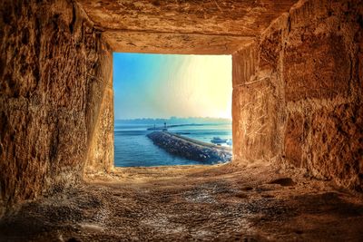 Scenic view of sea against sky seen through window