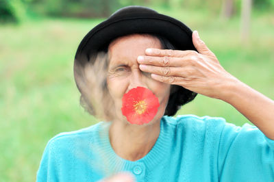 Close-up of man holding fruit