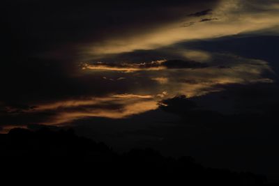 Low angle view of dramatic sky at sunset