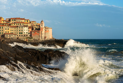 Rough sea in front of the small and ancient tellaro village, lerici, la spezia, liguria, italy.