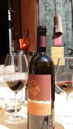 Close-up of wine bottles on table at restaurant