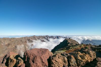 View of landscape against blue sky