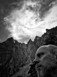 Portrait of man on mountain against sky