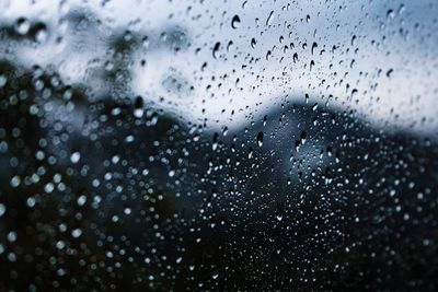 Full frame shot of raindrops on glass window