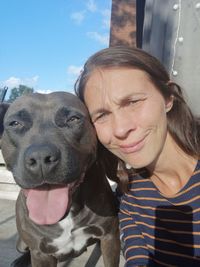 Portrait of smiling woman with dog