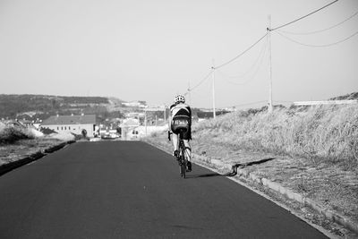 Woman walking on road