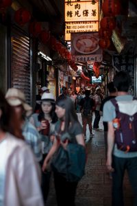 People walking on street in city