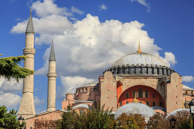 View of mosque against cloudy sky