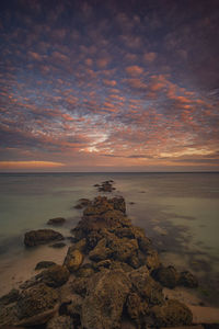 Scenic view of sea against sky during sunset