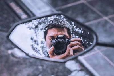 Portrait of man photographing