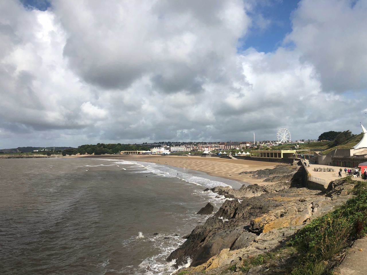 SCENIC VIEW OF BEACH AGAINST CLOUDY SKY