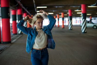 Portrait of woman standing in basement