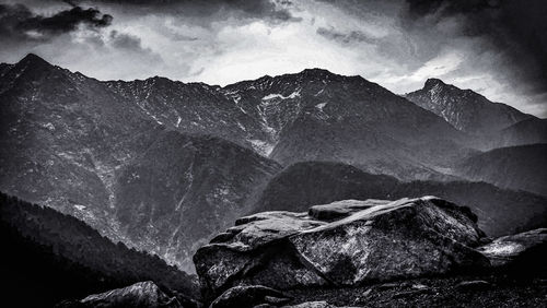 Scenic view of rocks in mountains against sky