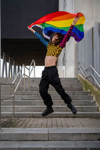 Low section of woman walking on footpath