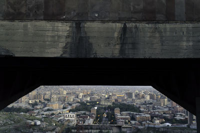 Cityscape seen through bridge