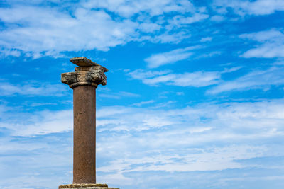 Low angle view of historical building against cloudy sky