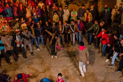 High angle view of people standing on stage