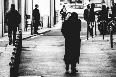 Full length of woman walking on escalator