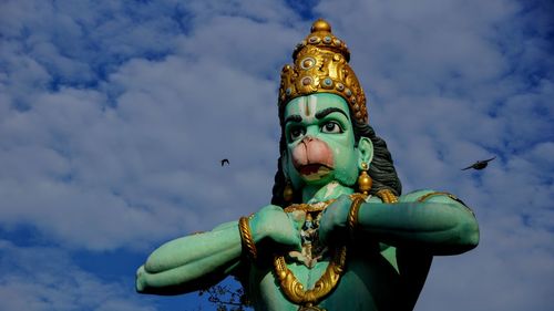 Low angle view of statue against sky