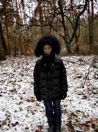 Portrait of man standing in snow