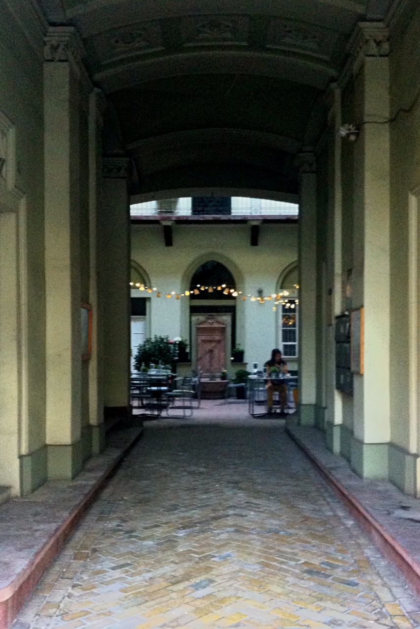 architecture, indoors, built structure, arch, the way forward, corridor, empty, diminishing perspective, architectural column, ceiling, illuminated, column, interior, vanishing point, absence, archway, long, flooring, building, narrow