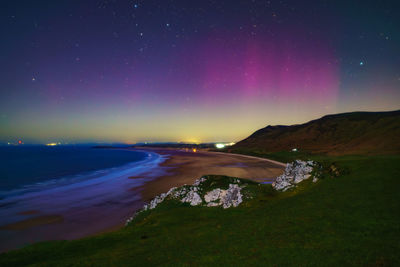 Scenic view of sea against sky at night