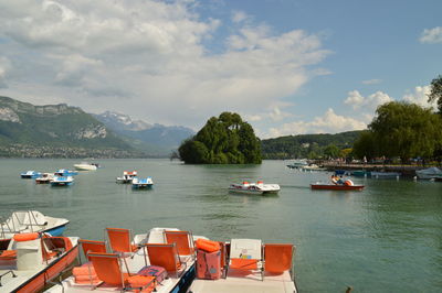 Boats moored in sea against sky
