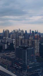 High angle view of modern buildings in city against sky