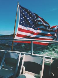 American flag on boat railing